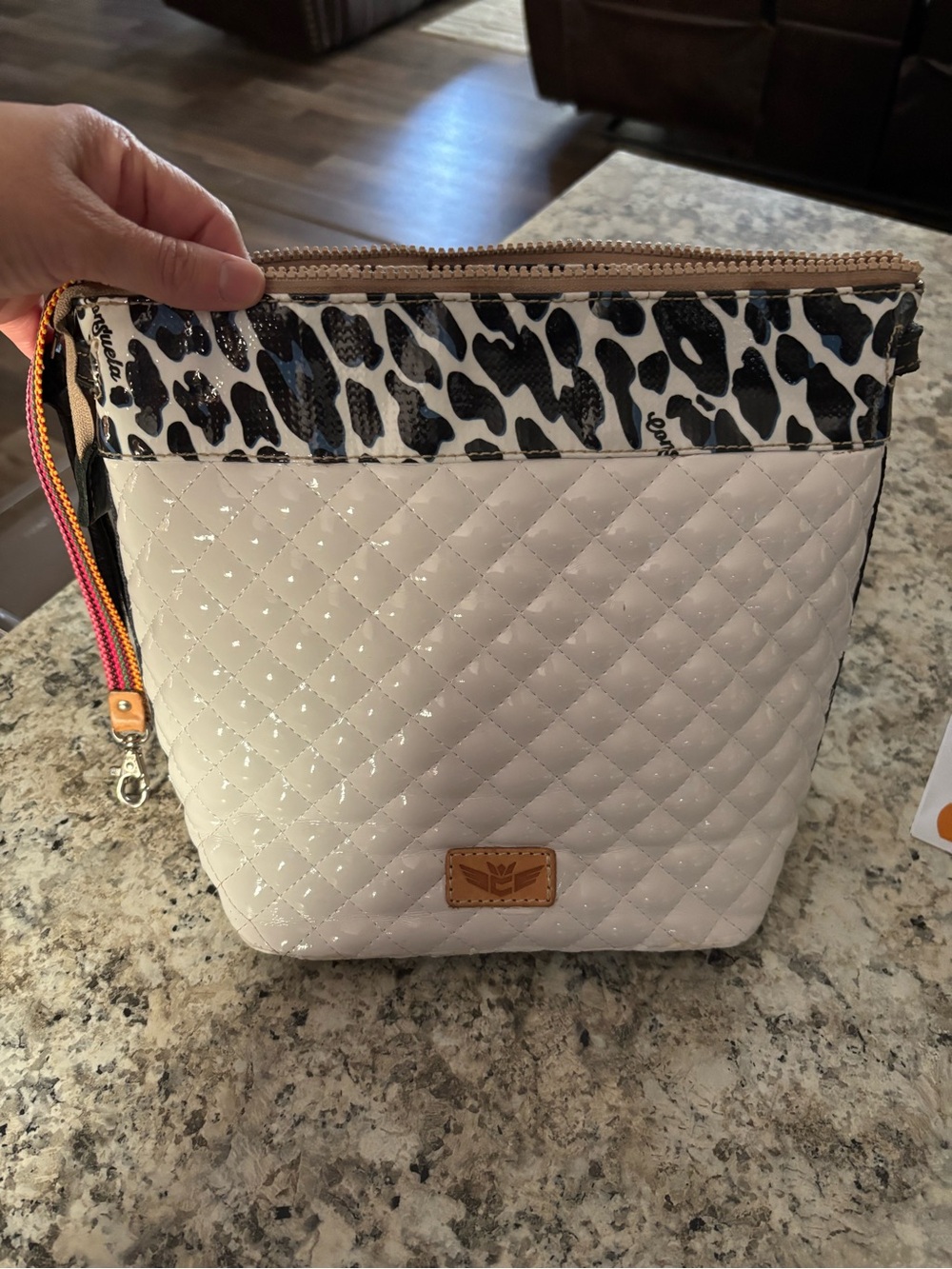 Consuela white Quilted with Black Leopard Trim bag has no strap.